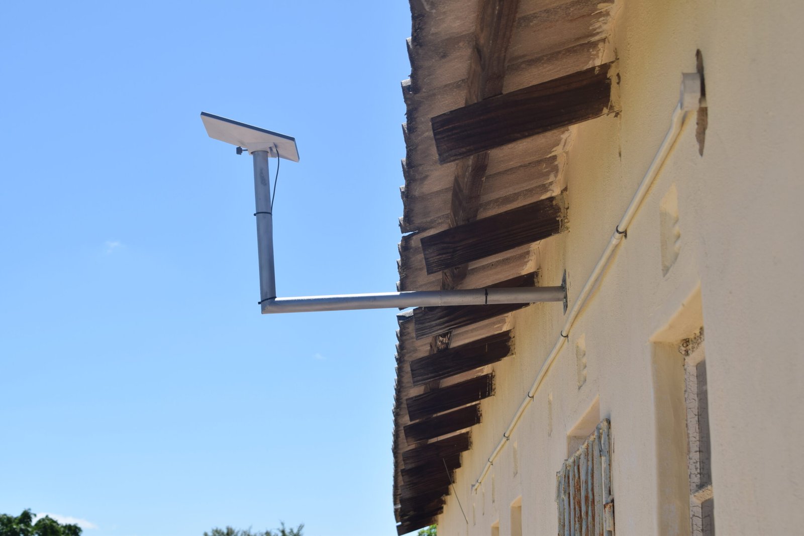 Starlink dish mounted on a building by DevSphere